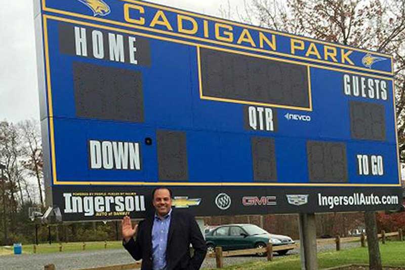 Ingersoll Cadillac of Danbury's name is on a local sports scoreboard for donating